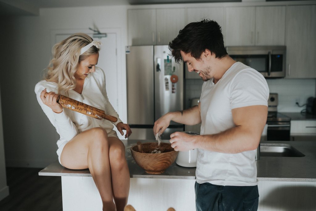 Couple laughing and baking