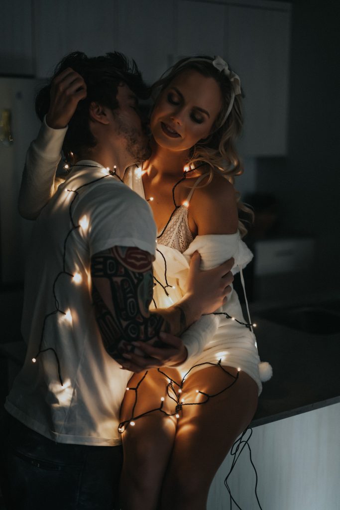 Couple lit with twinkle lights