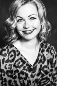 portrait of woman in animal print top