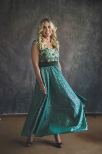 woman twirling in green dress