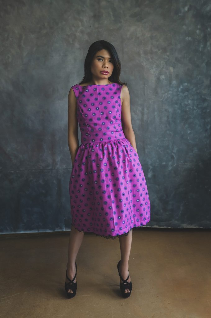 woman modelling pink patterned dress